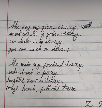 Image of this poem handwritten in cursive on notebook paper. It showcases a new way to write a cursive Z that I found.